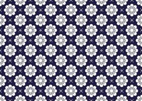 White symbol flowers form on dark blue background, ethnic fabric seamless pattern design for cloth, carpet, batik, wallpaper, wrapping etc. vector