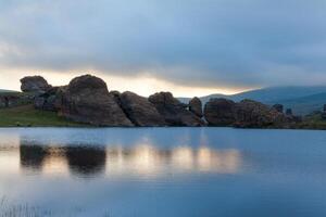 Rock Reflections on the water photo