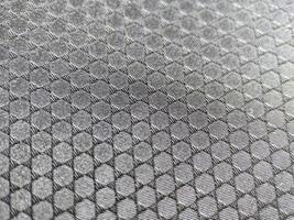 Macro of black hexagon fabric texture photo