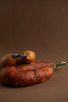 Traditional Alentejo sausages - linguica and farinheira - on a rustic brown background. photo