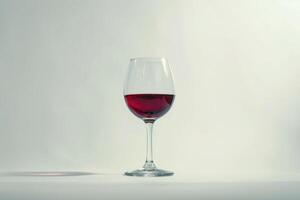 moving red wine glass over a white background photo