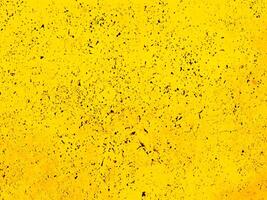 extured Weathered Yellow Wall Background. photo