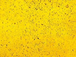 extured Weathered Yellow Wall Background. photo