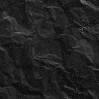 Abstract Background, Textured Surface of Crumpled Black Paper. photo