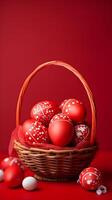 A basket of colorful eggs with copyspace on a red background. Easter egg concept, Spring holiday photo