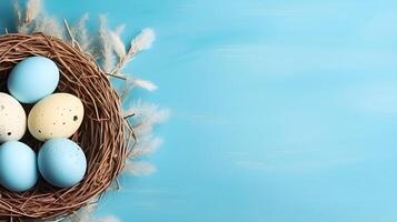 A basket of colorful eggs with copyspace on a blue background. Easter egg concept, Spring holiday photo