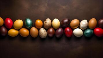 Colorful eggs with copyspace on brown background. Easter egg concept, Spring holiday photo