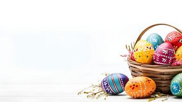 A basket of colorful eggs with copyspace on a white background. Easter egg concept, Spring holiday photo