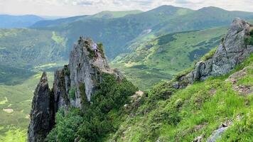 Man walks along the mountains to the top. Travel concept active people on the way to victory move forward video