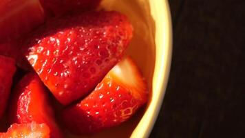 Ripe Red Strawberries in a bowl on table video