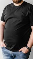 Big size fat adult man model in Blank black T Shirt for design mockup photo