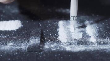 Cocaine addict rolls money and snorts it. video