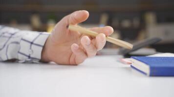 Close-up hand turning the pen, Thought. video