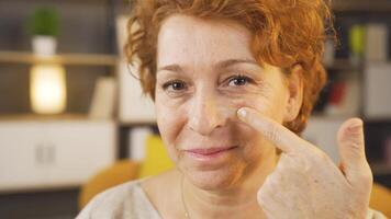 Portrait of happy woman applying makeup. video