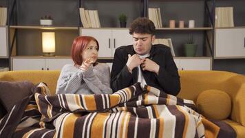 Couple feeling cold at home in winter. video