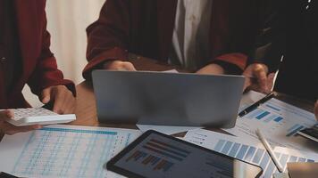 Financial analysts analyze business financial reports on a digital tablet planning investment project during a discussion at a meeting of corporate showing the results of their successful teamwork. video