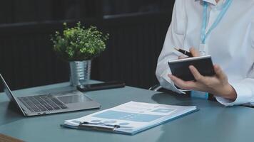 Young architect work project. Photo woman working with new startup project in modern loft. Generic design notebook on wood table. Horizontal, film effect video