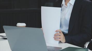 Young architect work project. Photo woman working with new startup project in modern loft. Generic design notebook on wood table. Horizontal, film effect video