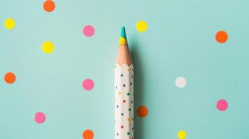 Blank mockup of a pencil with a dotted design giving it a fun and playful look. photo