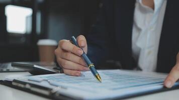 Young architect work project. Photo woman working with new startup project in modern loft. Generic design notebook on wood table. Horizontal, film effect video