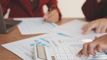 Financial analysts analyze business financial reports on a digital tablet planning investment project during a discussion at a meeting of corporate showing the results of their successful teamwork. video