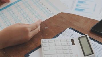 Financial analysts analyze business financial reports on a digital tablet planning investment project during a discussion at a meeting of corporate showing the results of their successful teamwork. video