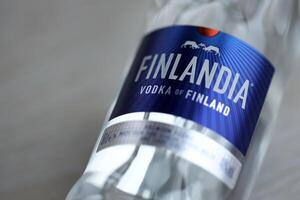 KYIV, UKRAINE - FEBRUARY 27, 2024 Bottle of famous Finlandia vodka alcohol drink on table photo