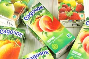 KHARKIV, UKRAINE - JANUARY 2, 2021 Sadochok various taste nectar from peach, apple and strawberry with orange flavour juice photo