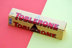 KYIV, UKRAINE - OCTOBER 31, 2023 Yellow Toblerone Chocolate Bar. Toblerone originated in Switzerland around 1908 photo