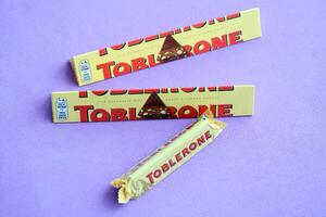 KYIV, UKRAINE - OCTOBER 31, 2023 Yellow Toblerone Chocolate Bar. Toblerone originated in Switzerland around 1908 photo