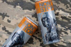 KYIV, UKRAINE - OCTOBER 31, 2023 Non Stop energy drink with limited edition design of Stalker and character with gas mask on aluminium tin can photo