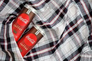 KYIV, UKRAINE - OCTOBER 31, 2023 Can of Coca Cola with coffee flavor. Closed tin can of drink with special design photo