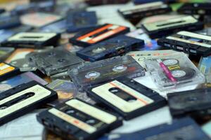 KYIV, UKRAINE - 4 MAY, 2023 Pile of audio cassettes lying on top of each other. Retro audio storage photo