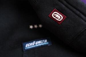 KYIV, UKRAINE - 4 MAY, 2023 Ecko Unltd company logo on new brand clothes photo