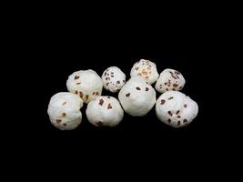 Lotus pops Seeds or Phool Makhana isolated on black background photo