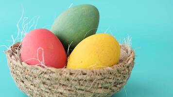 easter concept with multi color egg on pink background. video