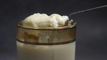 glass of whole cream milk on table , Cream of milk. video