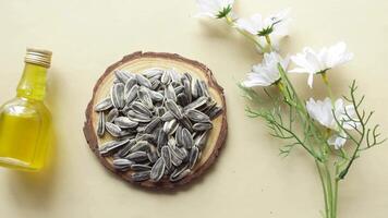 sunflower oil seed and oil in a container on table video