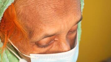 portrait of an old woman wearing a surgical mask video