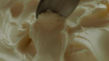 close up of spoon pick fresh butter in a container video