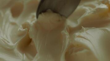 close up of spoon pick fresh butter in a container video