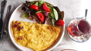 top view of Egg Omelette, green tea on a breakfast table table video