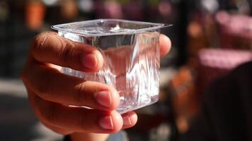 water in a plastic container on a table video