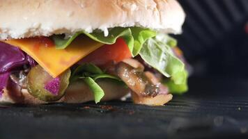 Sandwich with meatballs, lettuce, and red cabbage grilling at home video