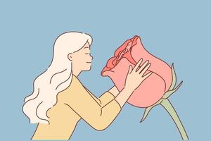 Woman sniffs huge rose flower, enjoying aroma of spring-blooming plant used to create perfume vector