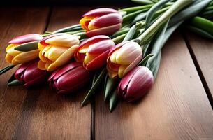 Spring flowers tulips banner copy space on wooden background table pink red yellow bouquet lying photo