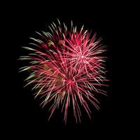 Colorful celebration fireworks isolated on black sky background. photo