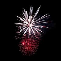 Colorful celebration fireworks isolated on black sky background. photo