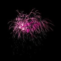 Colorful celebration fireworks isolated on black sky background. photo