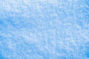 Texture of snow illuminated by sunlight. photo